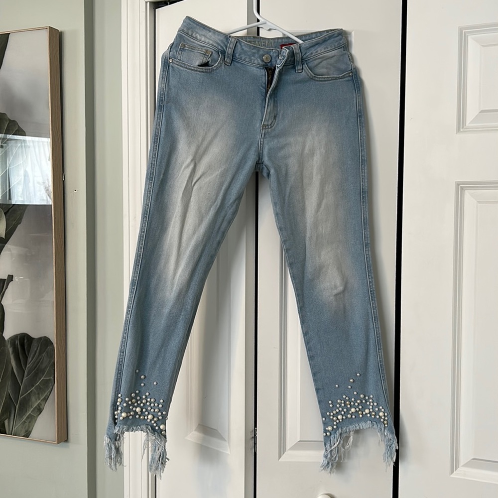 Light blue ripped jeans